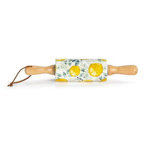 A small white decorative ceramic rolling pin with wood handles and a lemon illustration on the roller.