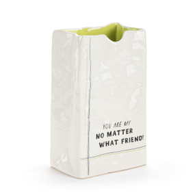 A small white ceramic vase that looks like a crinkly paper bag. The interior is light green and the saying "You are my no matter what friend!" on the front.