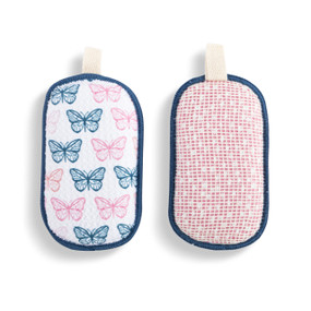 A set of two absorbent sponges in a pink and blue butterfly pattern. Each has a fabric tab at the top for hanging.