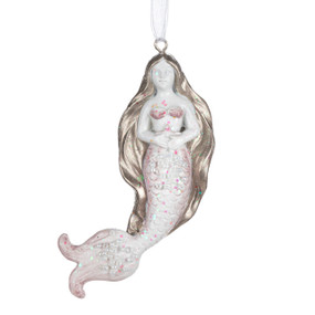 A light pink mermaid shaped ornament. She has long brown hair and is decorated with white beads.