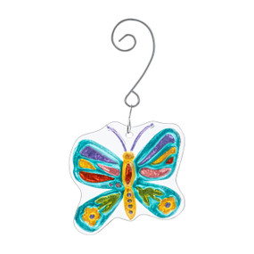 A glass ornament of a colorful butterfly hanging from a curved silver hanger.