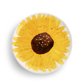 A round ceramic plate painted on the inside to look like a yellow sunflower.