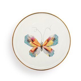 A white ceramic plate with a gold rim and blue and yellow butterfly artwork. There is a keyhole on the back for hanging.