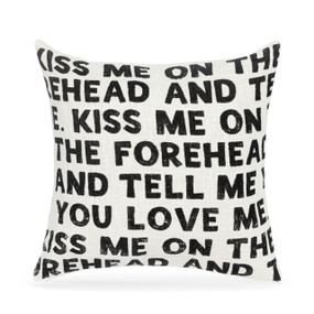 A white square pillow with words about telling me you love me in bold black on the front.