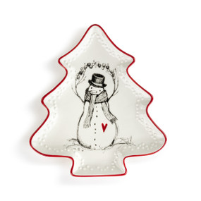 A tree shaped white ceramic platter with a red rim. The inside has an illustrated snowman with a red heart.
