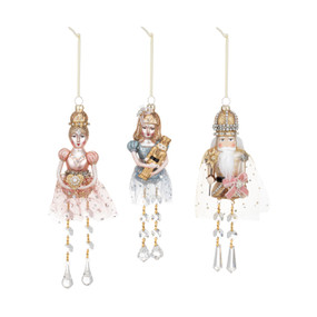 Three different glass blown ornaments decorated with glitter and beads. Each is a different character from the Nutcracker.