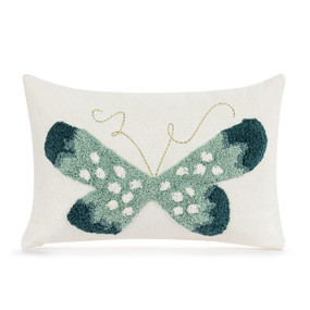 A white rectangular pillow with a green butterfly on the front.