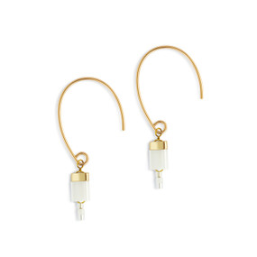 Gold hanging earrings with white and gold tile beads at the end.