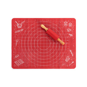 A red baking mat with a grid and a red rolling pin with wood handles.