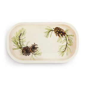 A cream rectangular melamine platter with an illustration of green pine branches and pinecones around the outside.