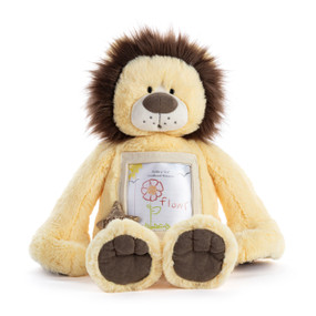 A light yellow and brown plush lion with an opening on his chest to hold a picture.