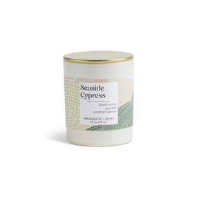 A 3.5 oz seaside cypress scented candle in a round white container with a gold lid.