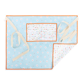 A white and light blue half apron with small white flowers on the front along with a pocket and cream ties.