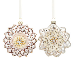 Two different glass snowflake ornaments decorated with paper and beads.