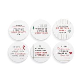 A set of six different white paperboard coasters each with a different holiday quote.