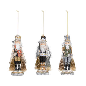 Three different nutcracker ornaments with silver and gold sparkle and accents.