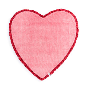 A red heart shaped blanket with a red frilled ribbon edge.