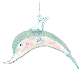A glass ornament shaped like a dolphin with small light blue beads decorating the top.