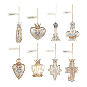 A set of eight different small silver and gold glittery ornaments in various shapes.