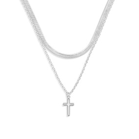 A layered silver necklace with a silver cross charm.