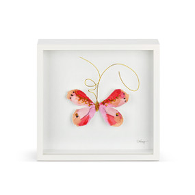 A pink and gold butterfly with gold wire tentacles in a white square framed wall art.