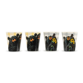 A set of four small cups in two different designs. Each has a plaid background and the image of a black bear either waving its paw or holding a sunflower.