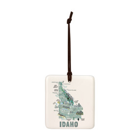 A square cream hanging tile magnet ornament with a map illustration of Idaho with landmarks and cities.