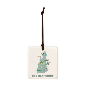 A square cream hanging tile magnet ornament with a map illustration of New Hampshire with landmarks and cities.