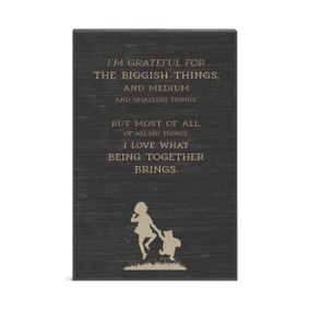 A dark gray wall art with Pooh and Christopher Robin. There is a saying about what they are grateful for.