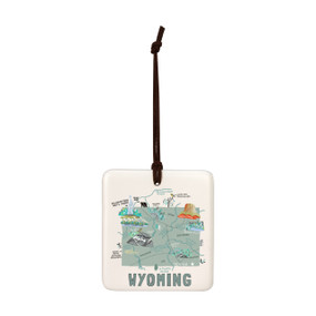 A square cream hanging tile magnet ornament with a map illustration of Wyoming with landmarks and cities.