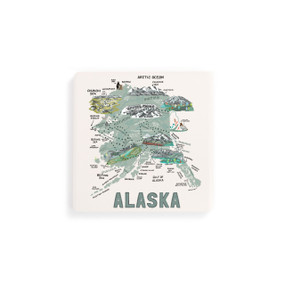 A set of four white square coasters with a map illustration of Alaska with famous landmarks and cities.