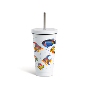 A white tumbler with a white lid and metal straw that has colorful fish around the glass.