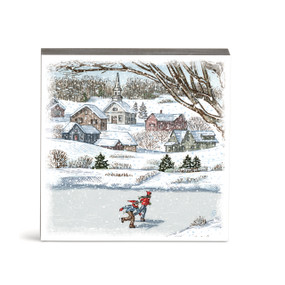 A square wall art with an illustration of a snowy village and two people skating on a frozen pond.