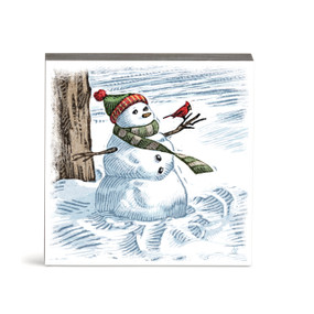 A square wall art with an illustration of a snowman in the snow with a cardinal perched on its arm.