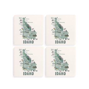 A set of four white square coasters with a map illustration of Idaho with famous landmarks and cities.