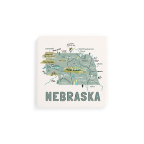 A set of four white square coasters with a map illustration of Nebraska with famous landmarks and cities.