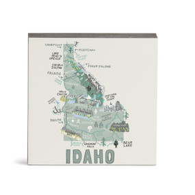 A white square wall art with an illustrated map of Idaho with landmarks and cities.