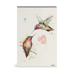 A watercolor wall art of two hummingbirds, one in flight and the other perched on a branch.