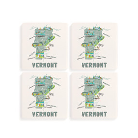 A set of four white square coasters with a map illustration of Vermont with famous landmarks and cities.