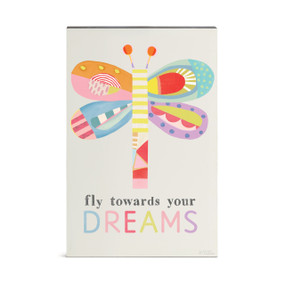A wall art of a pastel colorful dragonfly and the saying "fly towards your Dreams".