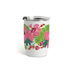 A white tumbler with a clear plastic lid and pink tropical flowers around the glass.