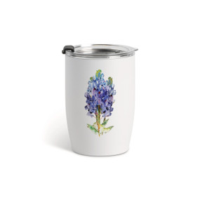 A white tumbler with a clear plastic lid and a watercolor image of a bluebonnet flower on the front.