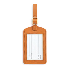 Front facing view of a saddle brown luggage tag, showing the opening with the ID information card. The brown strap is at the top.