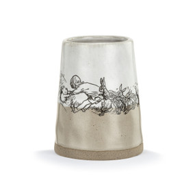 Front facing view of a light brown and white ceramic vase with an illustration of Winnie the Pooh being pulled out of Rabbit's den by all his friends.
