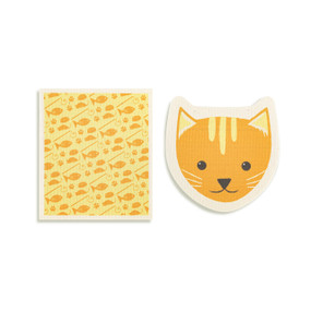Top down view of a set of biodegradable dish towels set side by side. The towel on the right is an orange cat's face. The towel on the left is rectangular and has a print of orange cat toys on a yellow background.