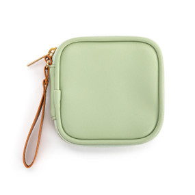 Top down view of a sage green tech organizer case. The brown strap is on the case's upper right side.