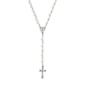 Detail view of the centerpiece and pendant of a silver rosary with pearls and silver crucifix.