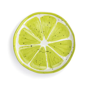 Top down view of a large plate with an image of a cut lime on the surface.