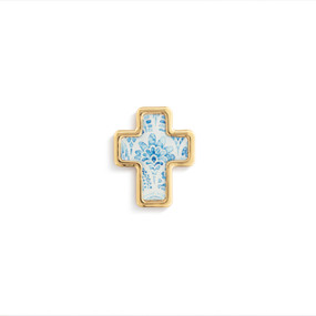 Top down view of a gold cross shaped pin. The surface of the cross is a blue fountain-like spray design on a white background with gold edging.
