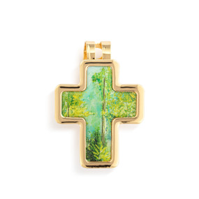 Top down view of a gold cross shaped visor clip. The surface of the cross is a scene of trees and bushes against a blue sky with gold edging.